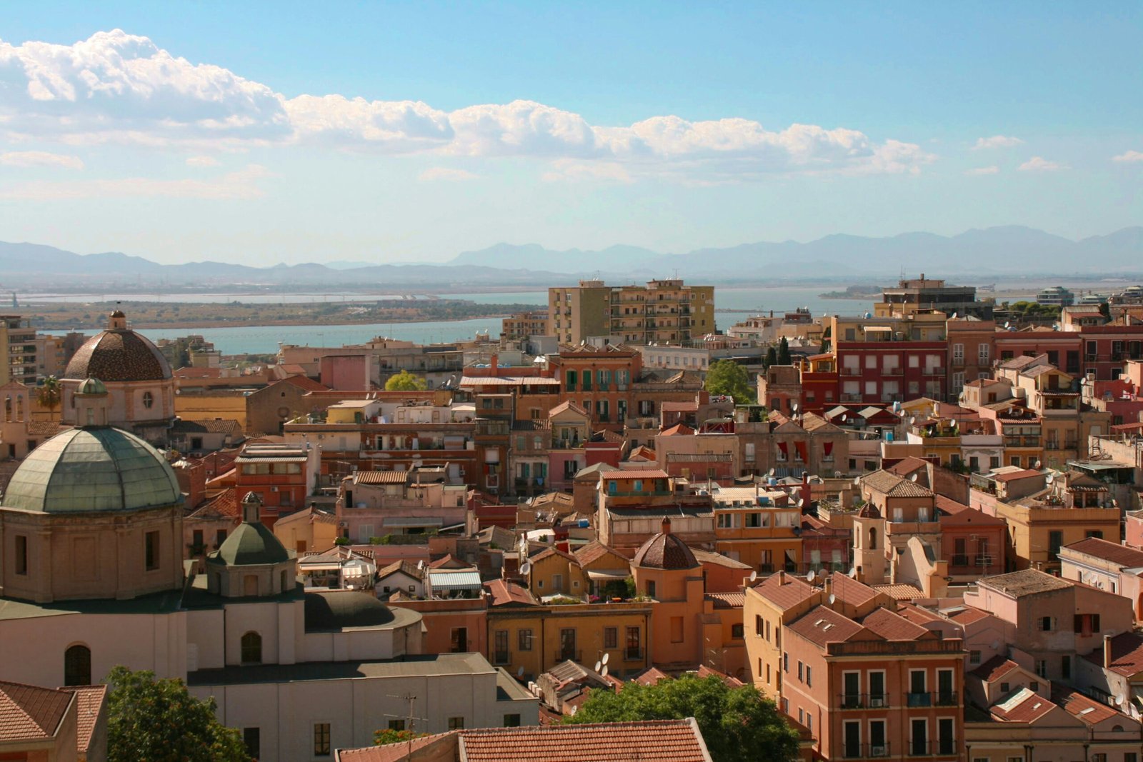 Cagliari-Sardinia Photo by <a href="https://unsplash.com/@lauralugaresi?utm_content=creditCopyText&utm_medium=referral&utm_source=unsplash">Laura Lugaresi</a> on <a href="https://unsplash.com/photos/aerial-view-of-city-buildings-during-daytime-4o2gxfuD5BU?utm_content=creditCopyText&utm_medium=referral&utm_source=unsplash">Unsplash</a>